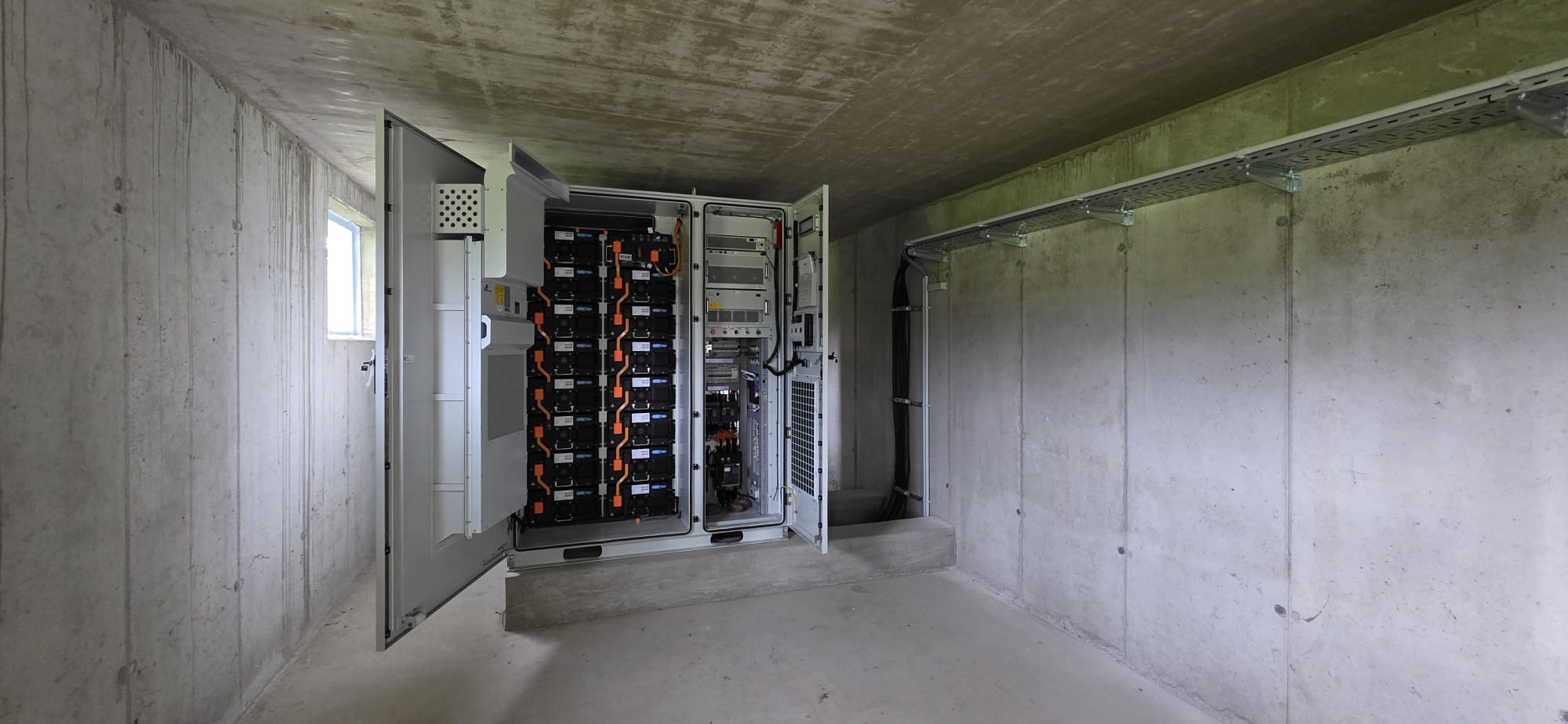 Battery storage in a concrete plant room