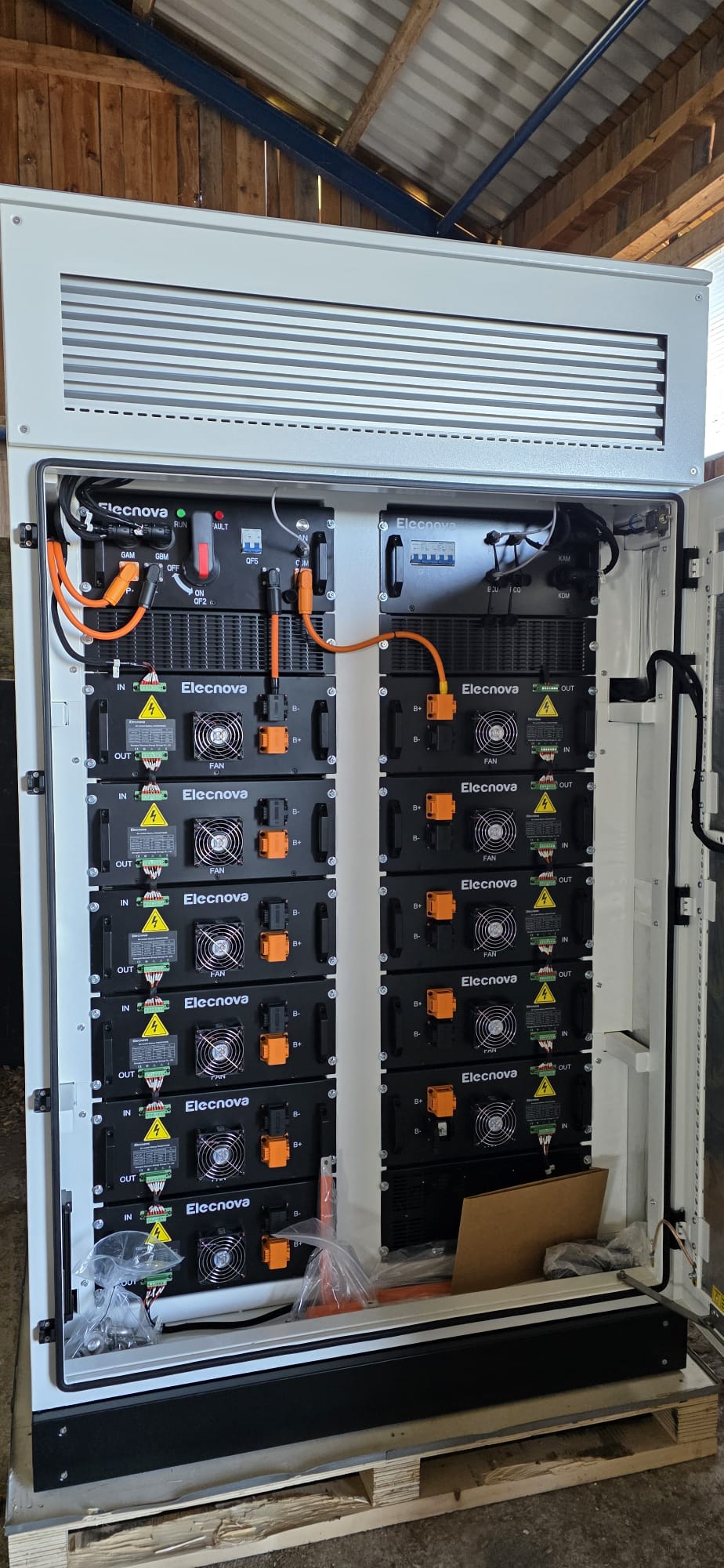 Opened Elecnova storage cabinet with battery modules
